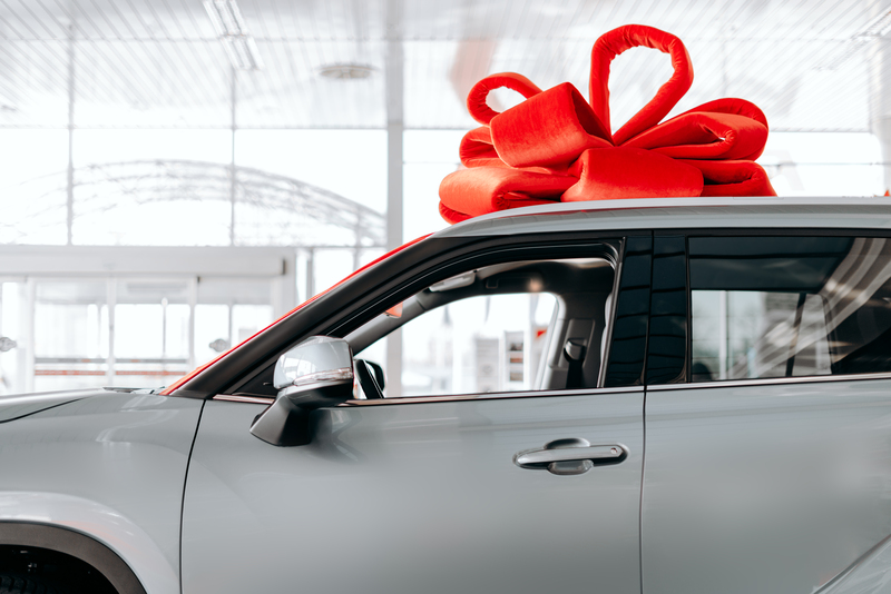 จองทะเบียนรถ new car is wrapped red bow beautiful gift concept 1